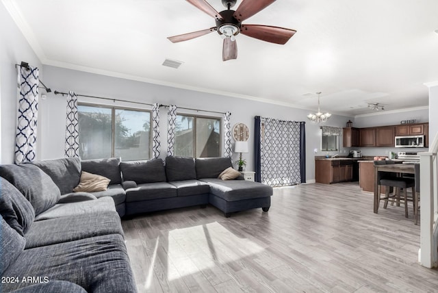 living room featuring crown molding, light hardwood / wood-style flooring, and ceiling fan with notable chandelier