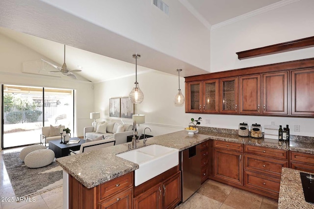 kitchen featuring pendant lighting, sink, light stone countertops, stainless steel dishwasher, and kitchen peninsula