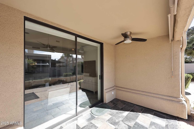 view of patio / terrace featuring ceiling fan