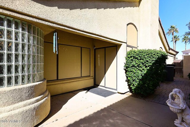 entrance to property featuring a patio area