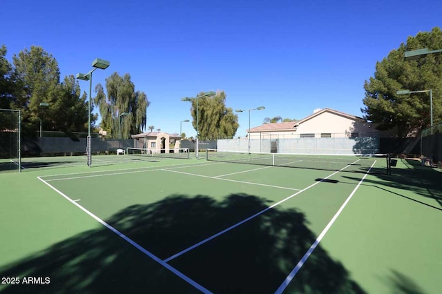 view of tennis court featuring basketball court