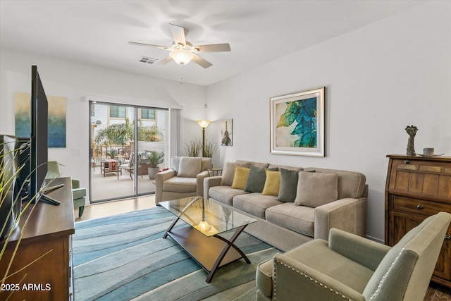 living room featuring ceiling fan