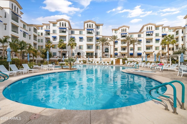 view of swimming pool with a patio area