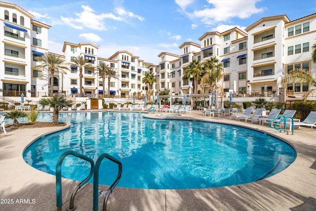 view of swimming pool with a patio