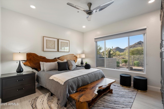 bedroom with baseboards, recessed lighting, and light wood finished floors