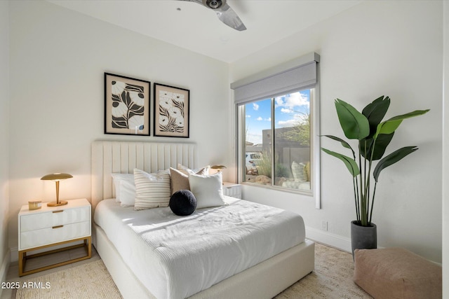 bedroom with baseboards and a ceiling fan