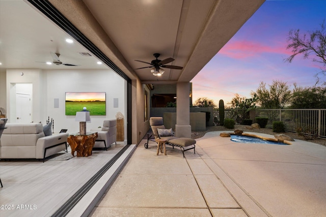 view of patio / terrace with visible vents, fence, and ceiling fan