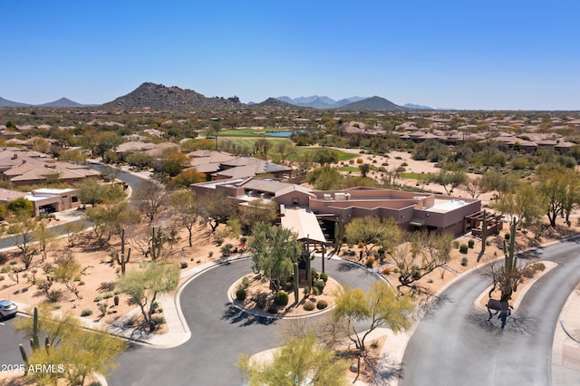 birds eye view of property featuring a mountain view