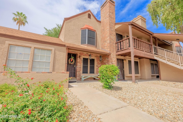 8111 W Wacker Rd Unit 62, Peoria, AZ 85381 - view of front of house featuring stucco siding and a chimney