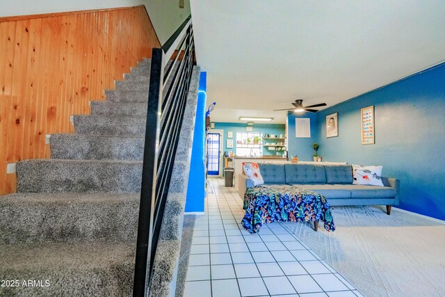 8111 W Wacker Rd Unit 62, Peoria, AZ 85381 - stairway featuring tile patterned floors, ceiling fan, and wooden walls