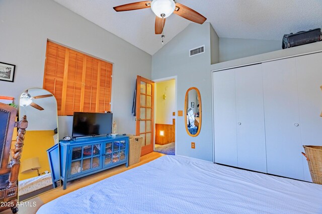 8111 W Wacker Rd Unit 62, Peoria, AZ 85381 - bedroom with wood finished floors, a closet, ceiling fan, and high vaulted ceiling