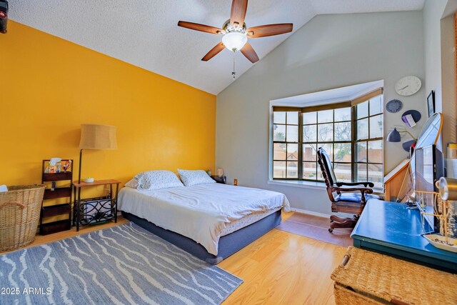 8111 W Wacker Rd Unit 62, Peoria, AZ 85381 - bedroom with high vaulted ceiling, wood finished floors, baseboards, and ceiling fan