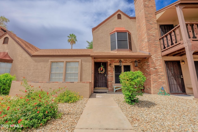 8111 W Wacker Rd Unit 62, Peoria, AZ 85381 - view of front of home featuring stucco siding, a balcony, and brick siding