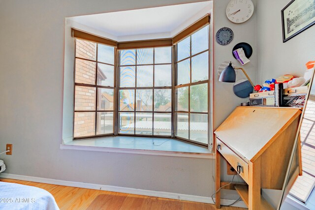 8111 W Wacker Rd Unit 62, Peoria, AZ 85381 - bedroom featuring multiple windows, baseboards, and wood finished floors