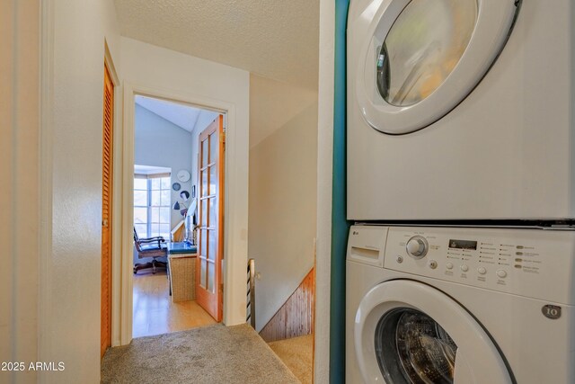 8111 W Wacker Rd Unit 62, Peoria, AZ 85381 - laundry room featuring stacked washer / drying machine and carpet flooring