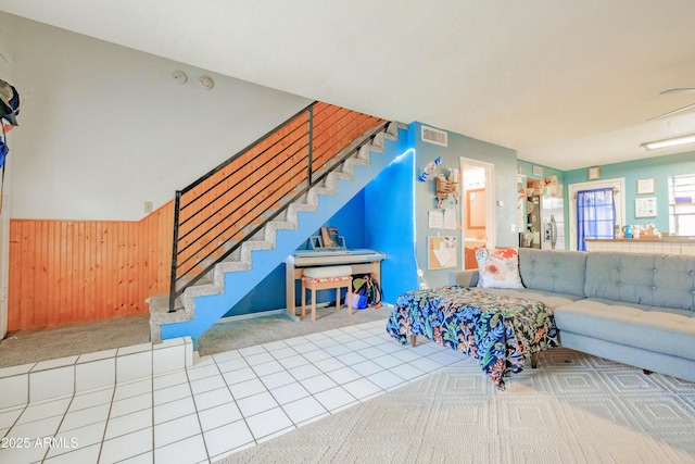 8111 W Wacker Rd Unit 62, Peoria, AZ 85381 - carpeted living room with a wainscoted wall, wood walls, and stairway