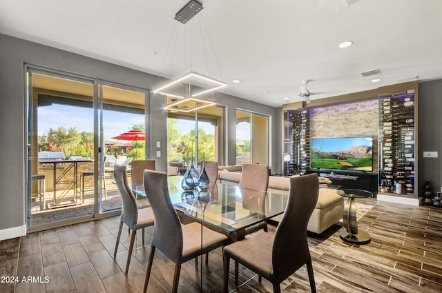 dining area featuring recessed lighting, visible vents, and wood tiled floor