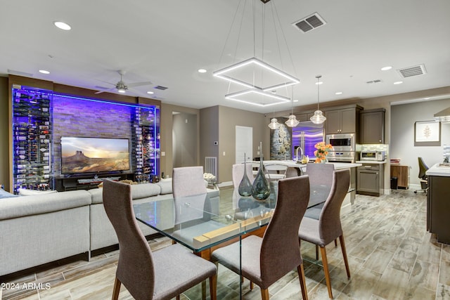 dining room with recessed lighting, visible vents, and wood finish floors