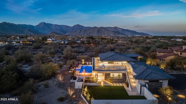 aerial view at dusk with a mountain view