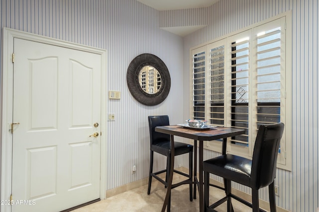 dining space featuring light tile patterned floors