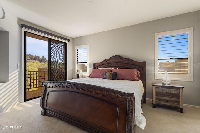 carpeted bedroom with access to outside