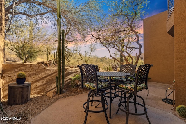 view of patio terrace at dusk