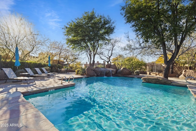 view of pool featuring a patio area and pool water feature