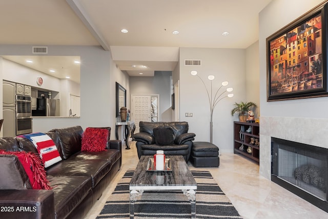 living room featuring beamed ceiling