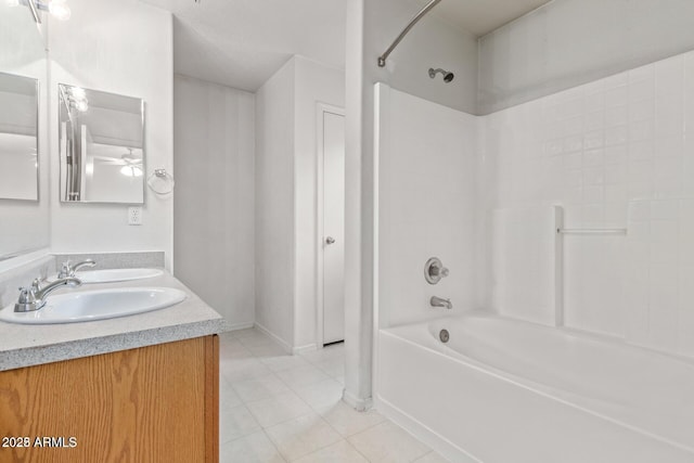 bathroom featuring a sink, tile patterned floors, double vanity, and tub / shower combination