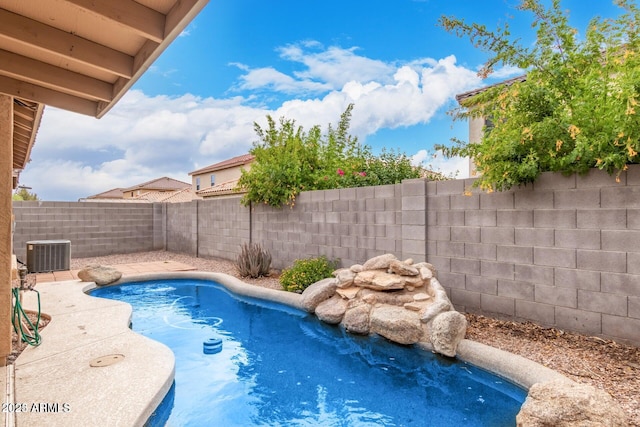 view of pool featuring a fenced in pool, central AC unit, and a fenced backyard