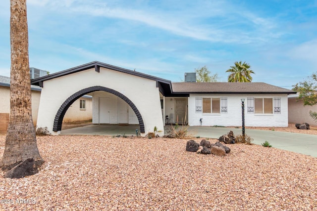 ranch-style house with a carport