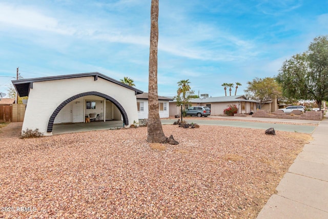 ranch-style home with a carport