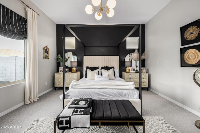 carpeted bedroom featuring an inviting chandelier