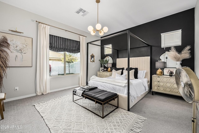 bedroom featuring carpet floors and an inviting chandelier