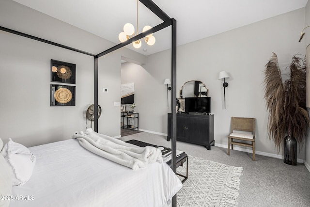 bedroom featuring light colored carpet and an inviting chandelier