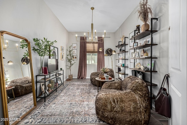 living area featuring hardwood / wood-style floors and a chandelier