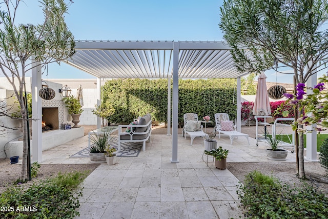 view of patio / terrace with exterior fireplace