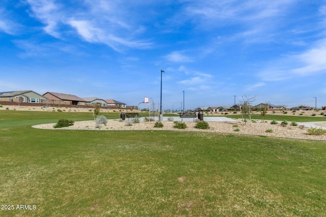 view of yard with basketball court