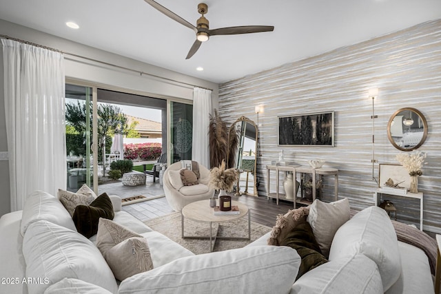 living room with ceiling fan and hardwood / wood-style flooring