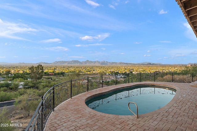 6349 E Hummingbird Ln, Paradise Valley, AZ 85253 - view of swimming pool with a mountain view and a patio area