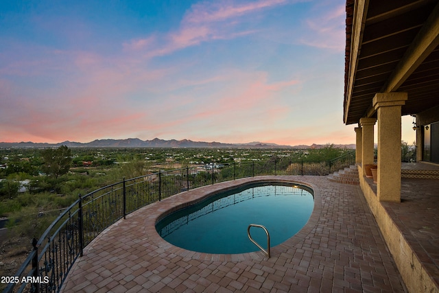 6349 E Hummingbird Ln, Paradise Valley, AZ 85253 - view of swimming pool with a mountain view and a patio