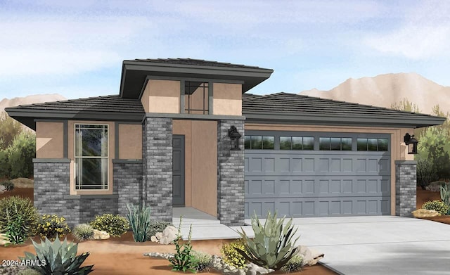 view of front facade with a mountain view and a garage