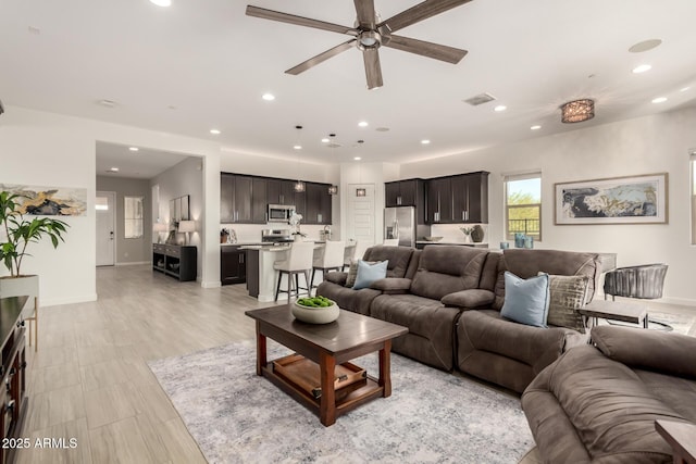 living room featuring ceiling fan