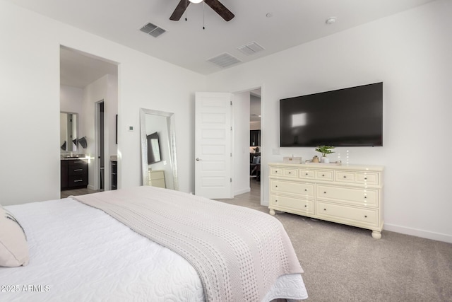 carpeted bedroom featuring ensuite bathroom and ceiling fan