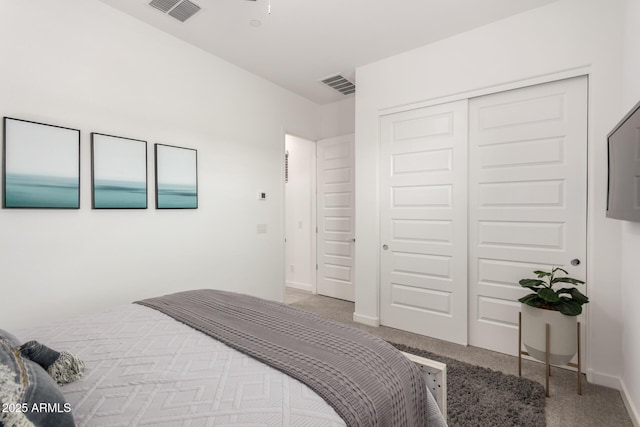 carpeted bedroom with a closet