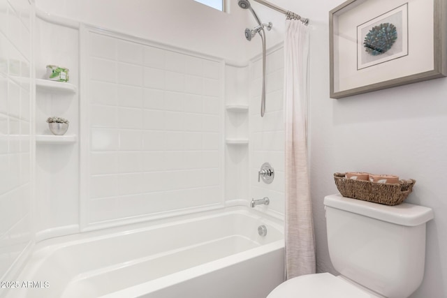 bathroom featuring shower / bath combination with curtain and toilet