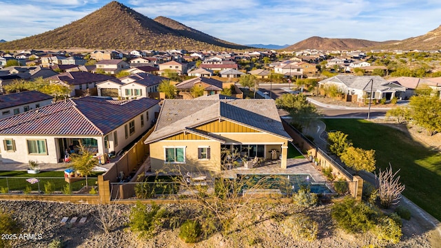 birds eye view of property with a mountain view