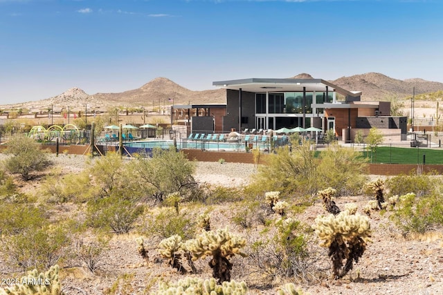 back of house featuring a mountain view