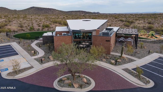 birds eye view of property with a mountain view