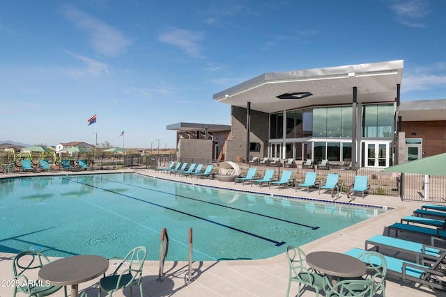 view of swimming pool with a patio